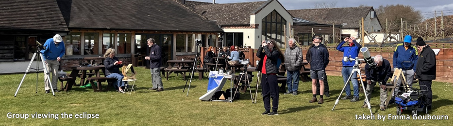 A group photo showing society members observing the solar eclipse