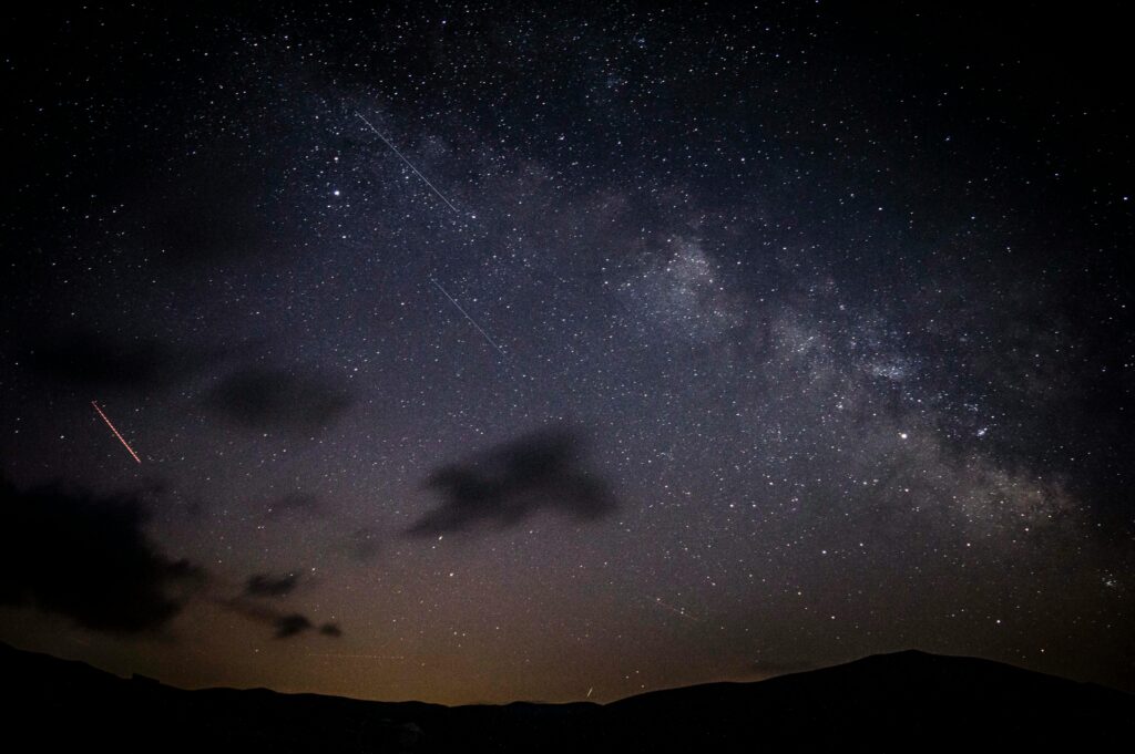 photo of the night sky showing a meteor shower