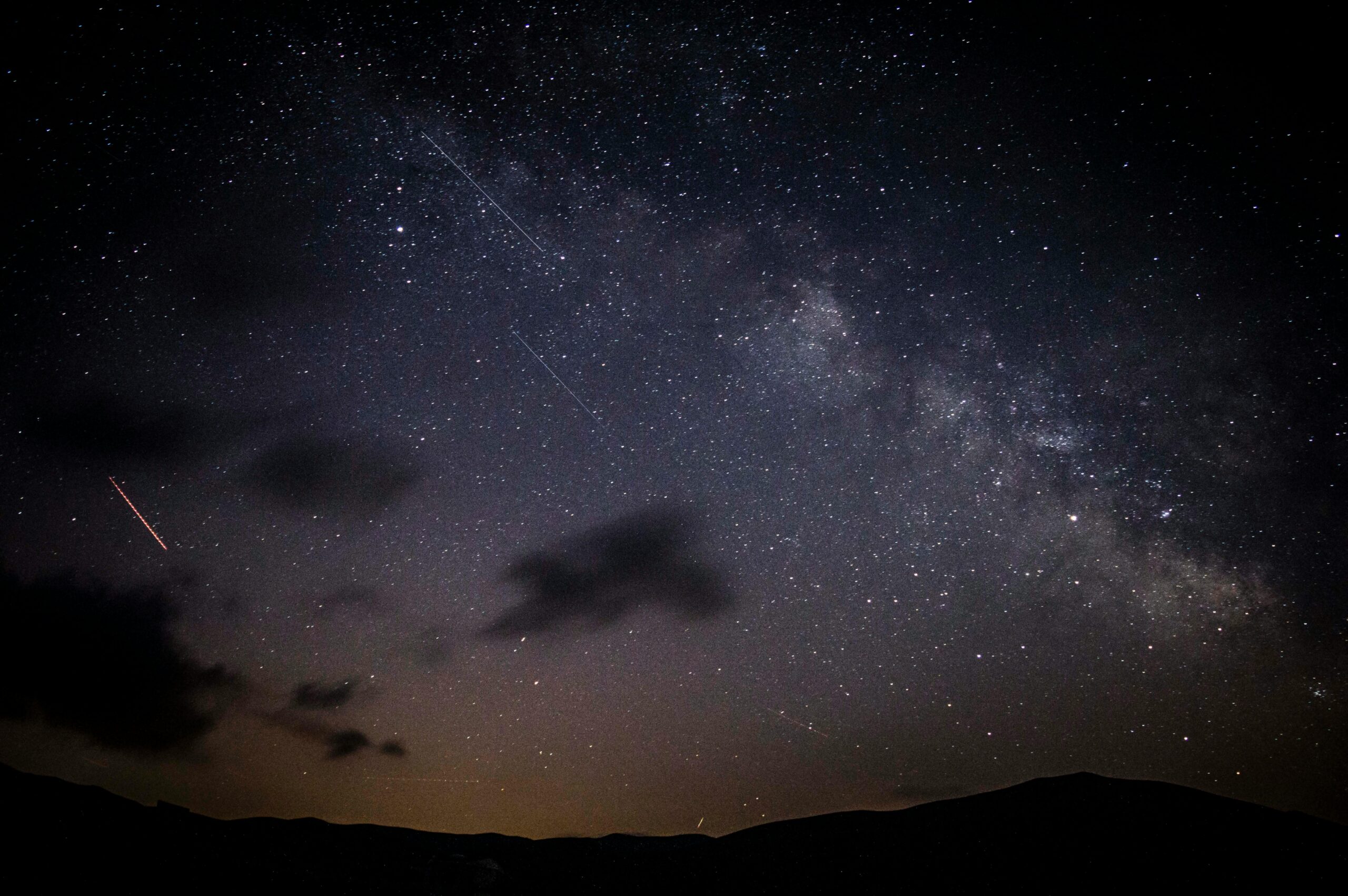 photo of the night sky showing a meteor shower